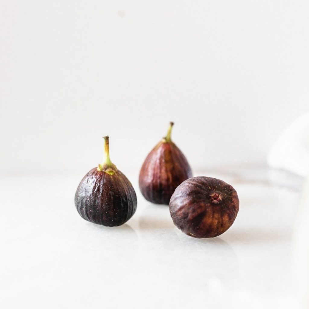 three figs on a white background.